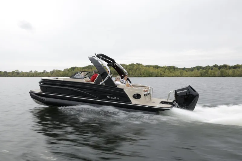 Slide: The Image of 2024 Sylvan G3 CLZ DC pontoon boat cruising on a lake. - 30