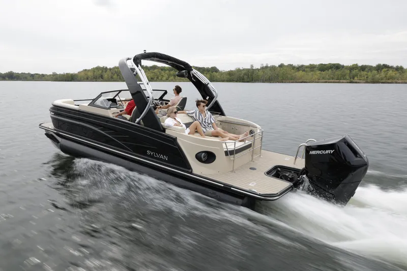 Slide: The Image of 2024 Sylvan G3 CLZ DC boat cruising on a lake with passengers. - 31