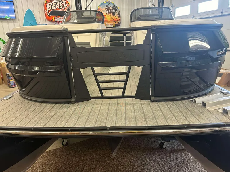 Slide: The Image of 2024 Sylvan G3 CLZ DC boat with sleek black exterior in showroom. - 6