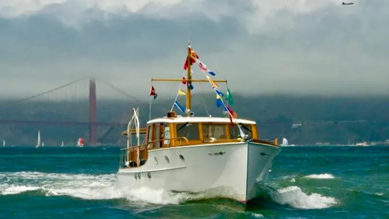 Slide: The Image of 1939 Stephens Brothers Bridgedeck Cruiser on water, Golden Gate Bridge in background. - 0