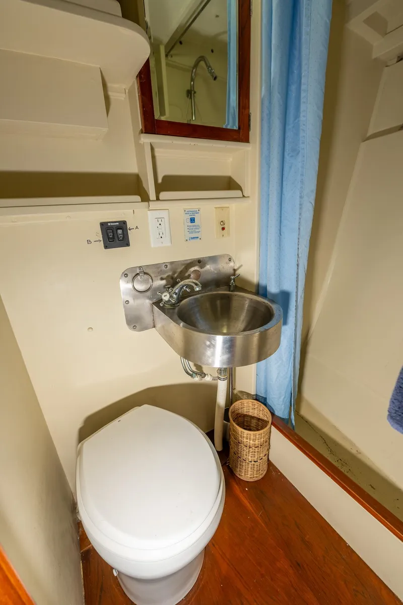 Slide: The Image of 1939 Stephens Brothers Bridgedeck Cruiser bathroom with stainless steel sink and toilet. - 16