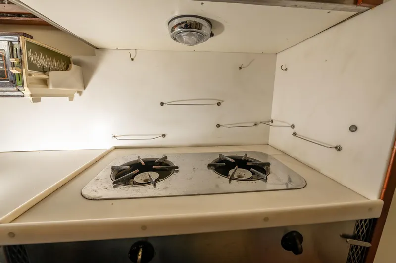 Slide: The Image of 1939 Stephens Brothers Bridgedeck Cruiser kitchen with vintage stove and storage. - 20