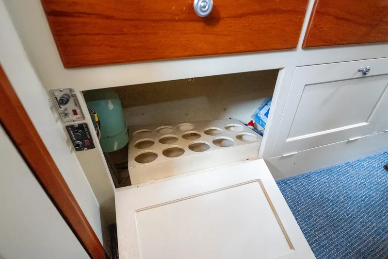 Slide: The Image of 1939 Stephens Brothers Bridgedeck Cruiser interior storage compartment with wooden cabinetry. - 23