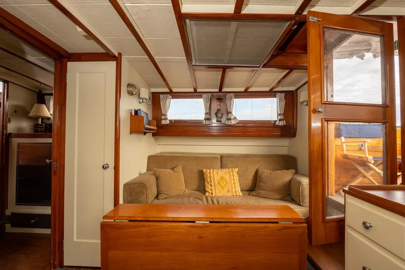 Slide: The Image of 1939 Stephens Brothers Bridgedeck Cruiser interior with cozy seating and wooden accents. - 27