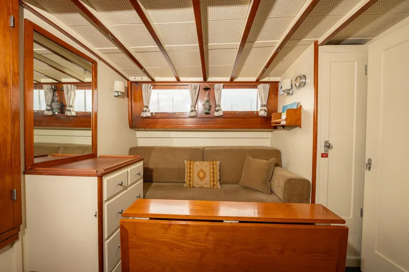 Slide: The Image of Interior of 1939 Stephens Brothers Bridgedeck Cruiser with cozy seating and wooden accents. - 28
