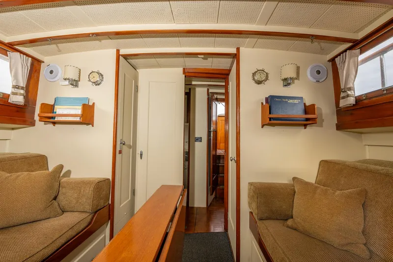 Slide: The Image of Interior of 1939 Stephens Brothers Bridgedeck Cruiser with cozy seating and wooden accents. - 29