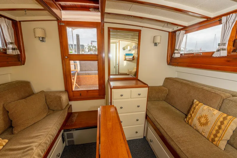 Slide: The Image of Interior of 1939 Stephens Brothers Bridgedeck Cruiser with cozy seating and wooden accents. - 33