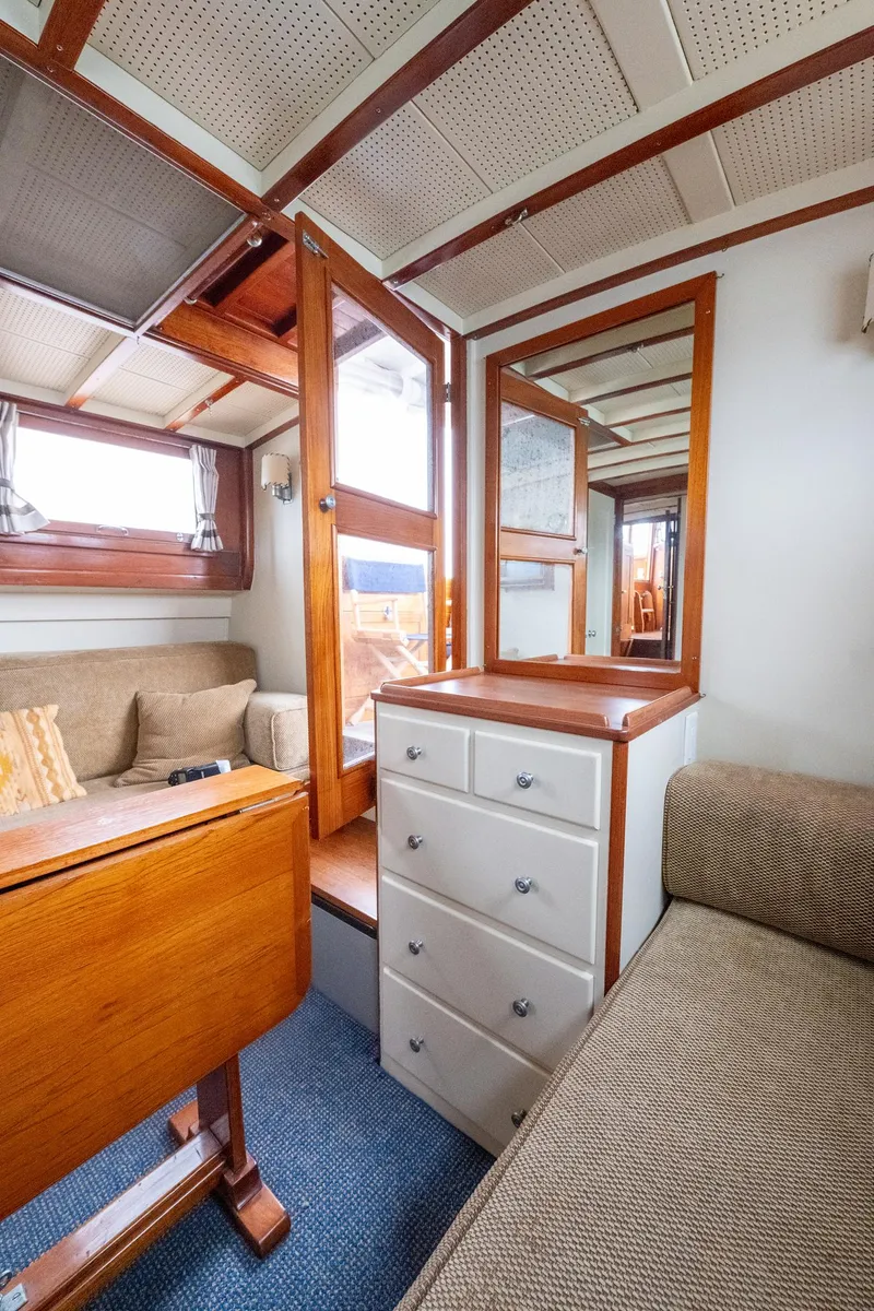 Slide: The Image of Interior of 1939 Stephens Brothers Bridgedeck Cruiser with wood accents and cozy seating. - 34