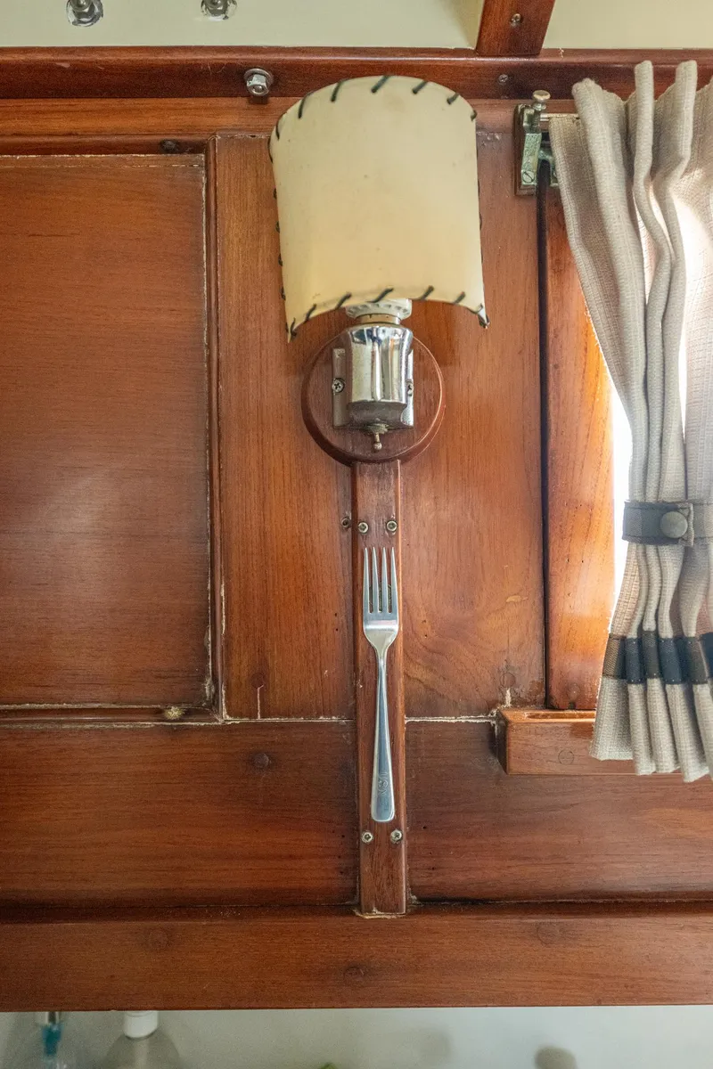 Slide: The Image of 1939 Stephens Brothers Bridgedeck Cruiser interior with wooden paneling and vintage lamp. - 35