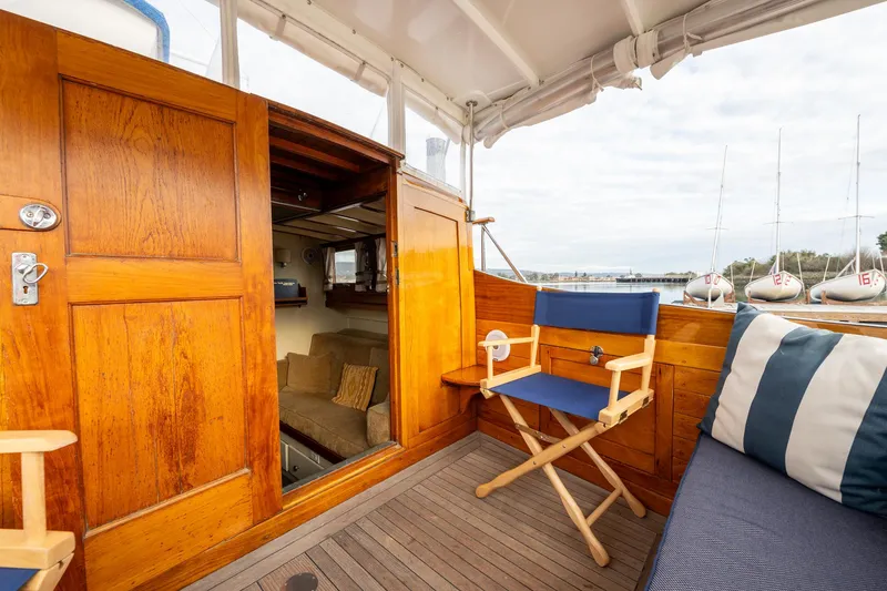 Slide: The Image of 1939 Stephens Brothers Bridgedeck Cruiser interior with wooden paneling and seating. - 38