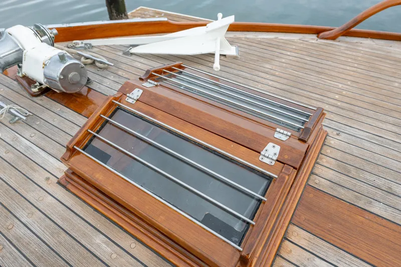 Slide: The Image of 1939 Stephens Brothers Bridgedeck Cruiser deck with wooden hatch and anchor. - 44