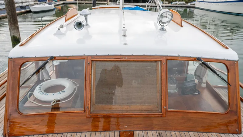 Slide: The Image of 1939 Stephens Brothers Bridgedeck Cruiser with wooden details and life preserver on deck. - 47