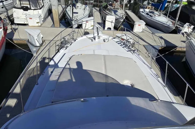 Slide: The Image of Helm of a 1975 Uniflite Aft Cabin yacht in harbor. - 10