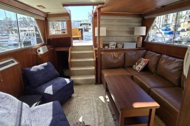 Slide: The Image of 1975 Uniflite Aft Cabin kitchen with wooden cabinets and appliances. - 22