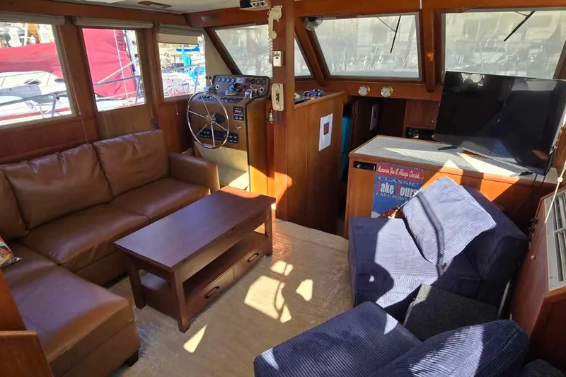 Slide: The Image of 1975 Uniflite Aft Cabin kitchen with wooden cabinets and double sink. - 23