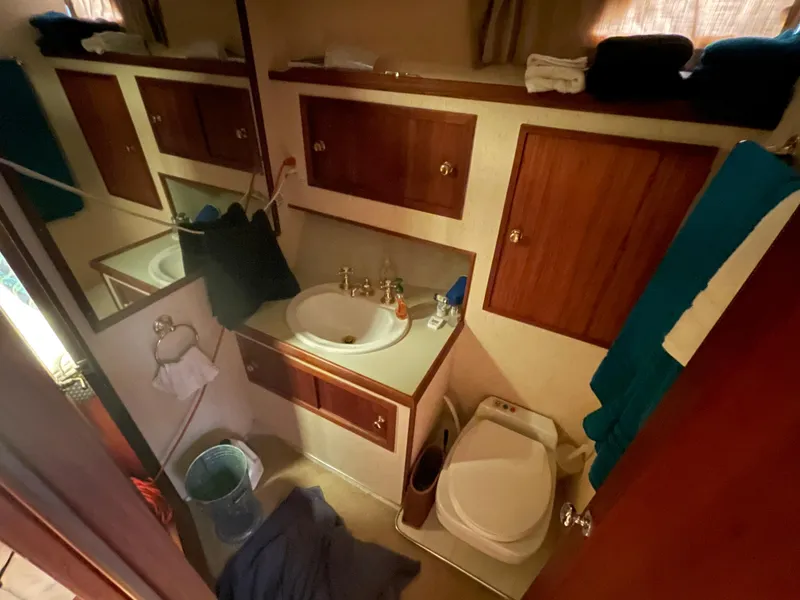 Slide: The Image of Engine room of 1975 Uniflite Aft Cabin boat with tools and fire extinguisher. - 43