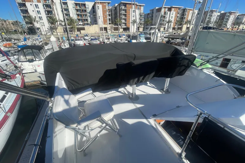 Slide: The Image of 1975 Uniflite Aft Cabin yacht with new bridge helm seating, docked in a marina. - 7