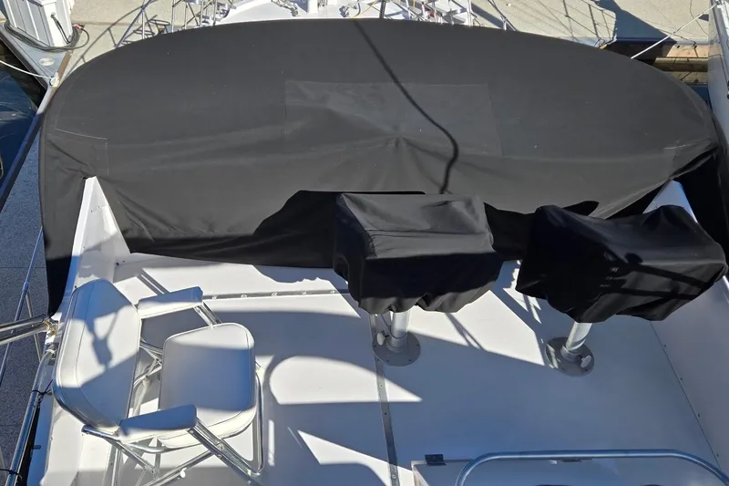 Slide: The Image of 1975 Uniflite Aft Cabin yacht docked at marina, shadow on deck. - 9