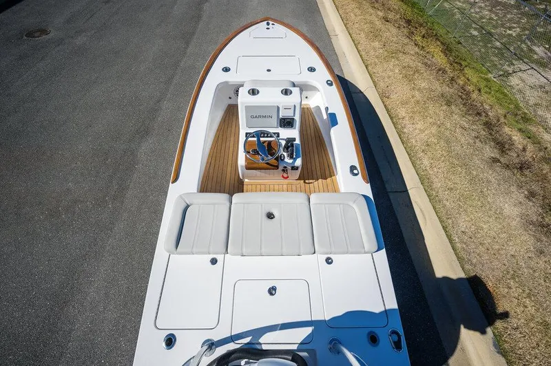 Slide: The Image of 2024 Xcelerator Boatworks 17 Flats boat with Garmin navigation, viewed from above. - 15