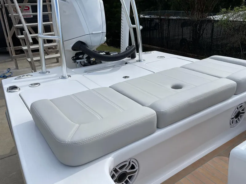 Slide: The Image of 2024 Xcelerator Boatworks 17 Flats with cushioned seating and sleek design. - 18