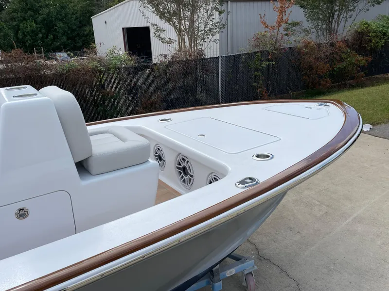 Slide: The Image of 2024 Xcelerator Boatworks 17 Flats boat with sleek design and modern features. - 19