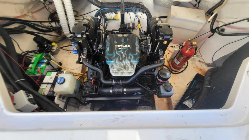 Slide: The Image of 2007 Chaparral 256 SSi boat engine compartment with 350 HP engine and fire extinguisher. - 11