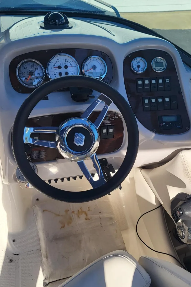 Slide: The Image of 2007 Chaparral 256 SSi boat dashboard with steering wheel and instrument panel. - 18