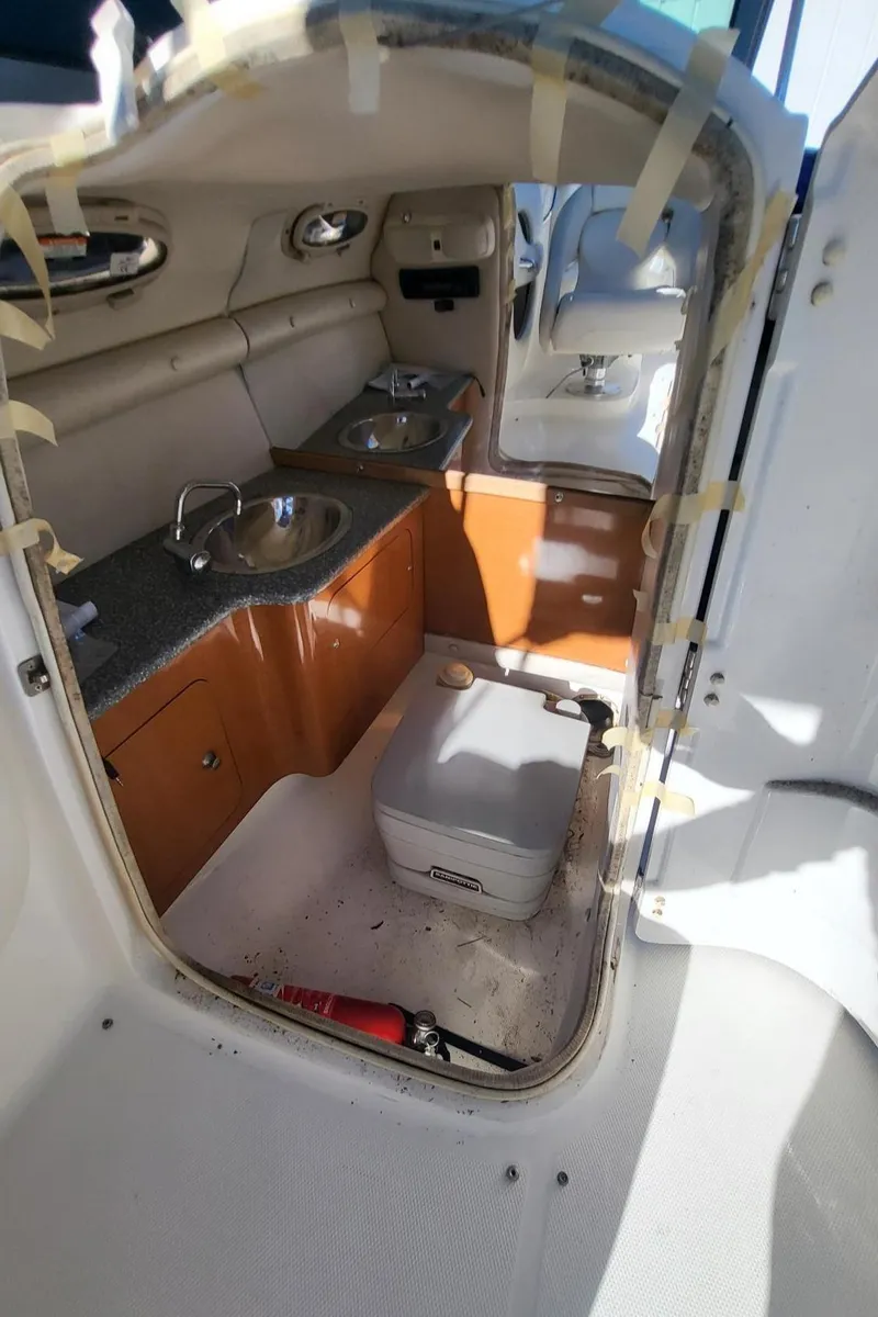 Slide: The Image of 2007 Chaparral 256 SSi boat interior with kitchenette and sink. - 19