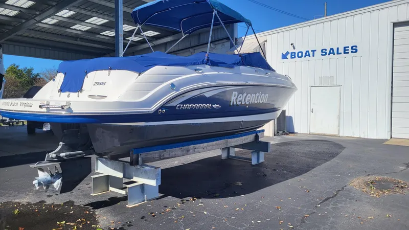 Slide: The Image of 2007 Chaparral 256 SSi boat on display at a boat sales dealership. - 2