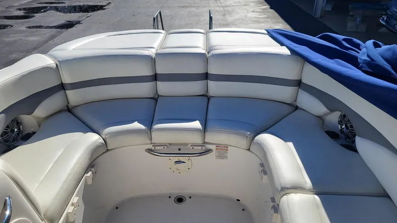 Slide: The Image of 2007 Chaparral 256 SSi boat interior with white and gray seating. - 4