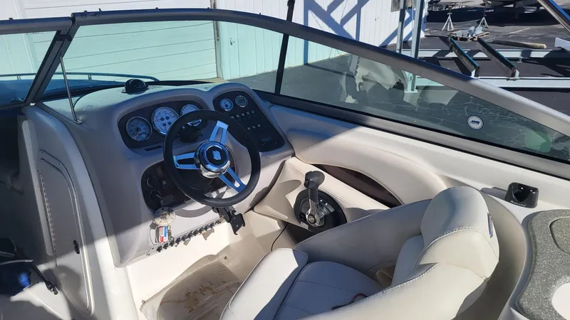 Slide: The Image of 2007 Chaparral 256 SSi boat cockpit with steering wheel and control panel. - 7
