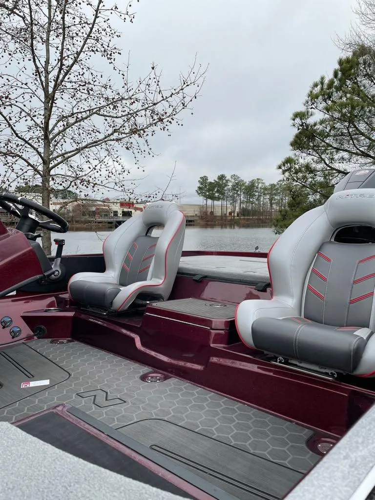 Slide: The Image of 2024 Nitro Z21 XL Pro boat interior with lake view. - 2