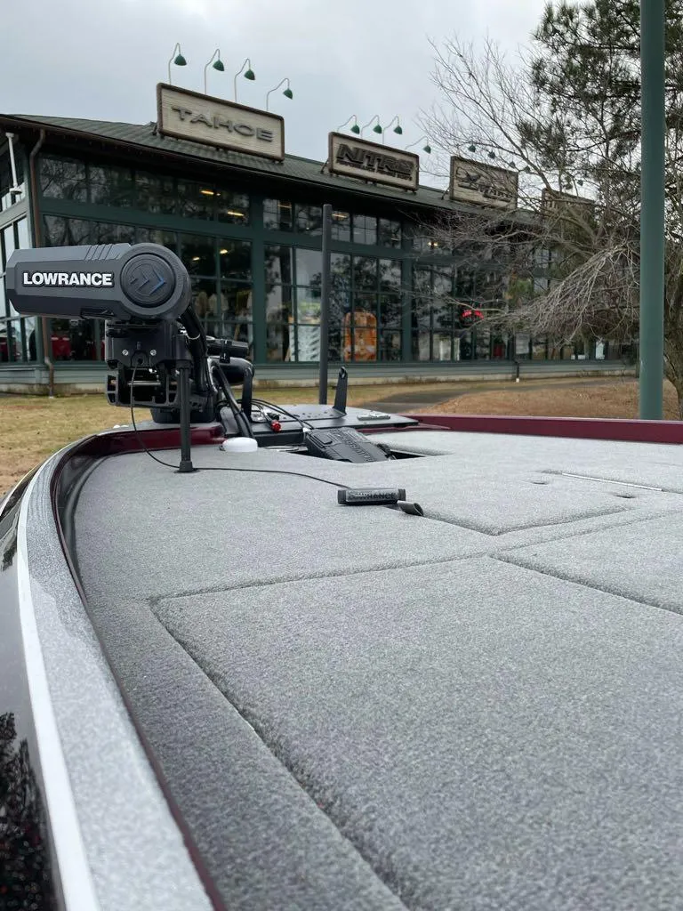 Slide: The Image of 2024 Nitro Z21 XL Pro boat with Lowrance equipment in front of a store. - 3