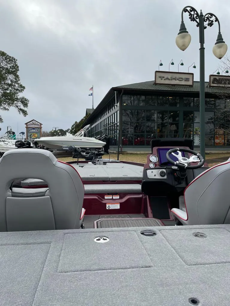 Slide: The Image of 2024 Nitro Z21 XL Pro boat interior at a dealership. - 4