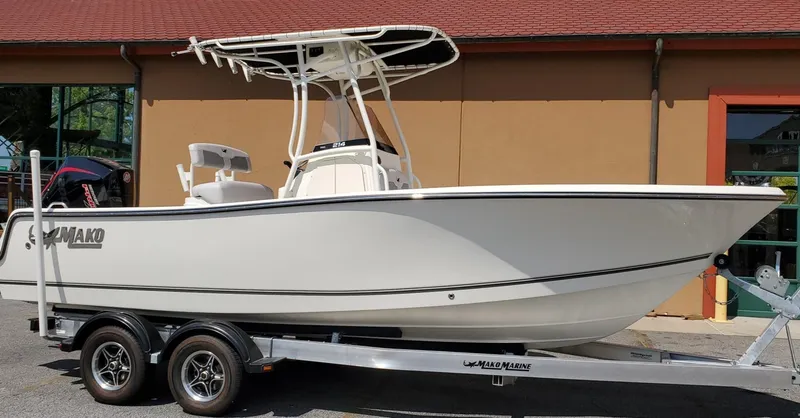 The Image of 2024 Mako 214 CC boat on trailer, side view, outdoors. - 0