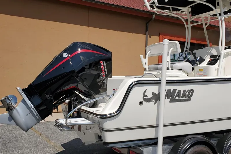 Slide: The Image of 2024 Mako 214 CC boat with powerful outboard motor on trailer. - 5