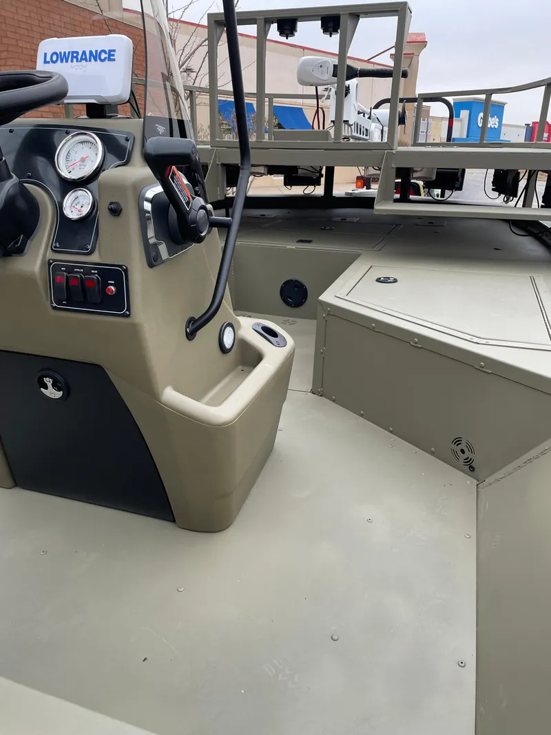 Slide: The Image of 2024 Tracker Grizzly 2072 CC Sportsman boat interior with Lowrance electronics. - 4