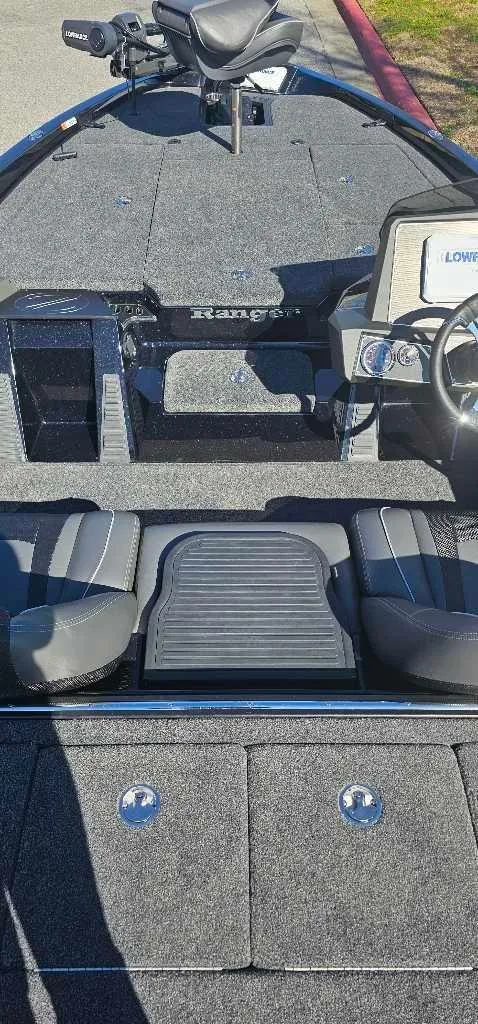 Slide: The Image of 2024 Ranger Z518 Ranger Cup Equipped boat interior with seating and control console. - 3