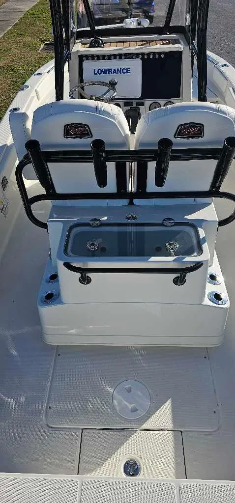 Slide: The Image of 2024 Ranger 2660 Bay boat interior with Lowrance electronics and seating. - 3