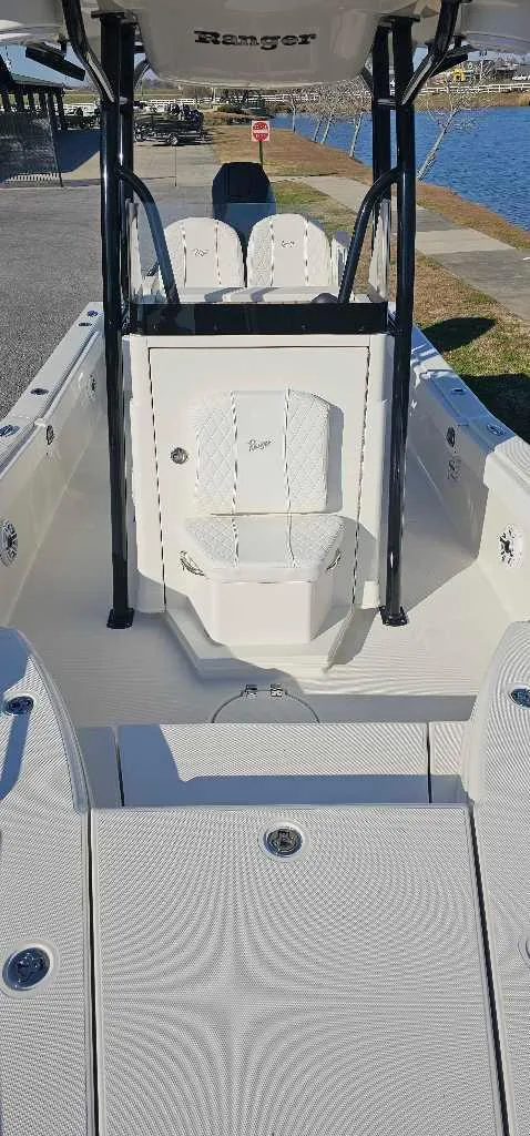 Slide: The Image of 2024 Ranger 2660 Bay boat interior with seating and storage compartments. - 4