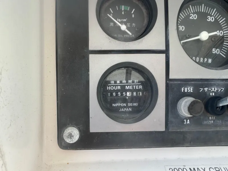 Slide: The Image of Hour meter and gauges on a 1995 Passport 47 AC Plan B boat. - 13