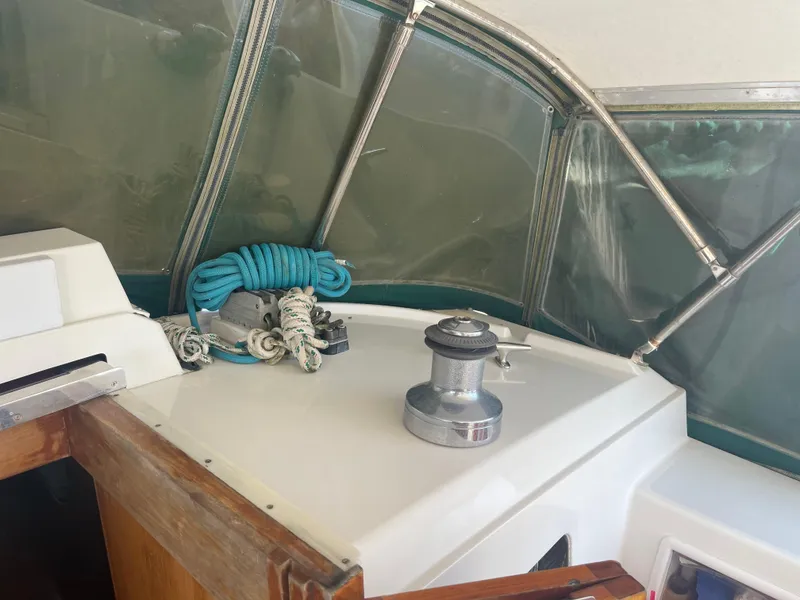 Slide: The Image of Cockpit of 1995 Passport 47 AC Plan B sailboat with winch and coiled blue rope. - 15