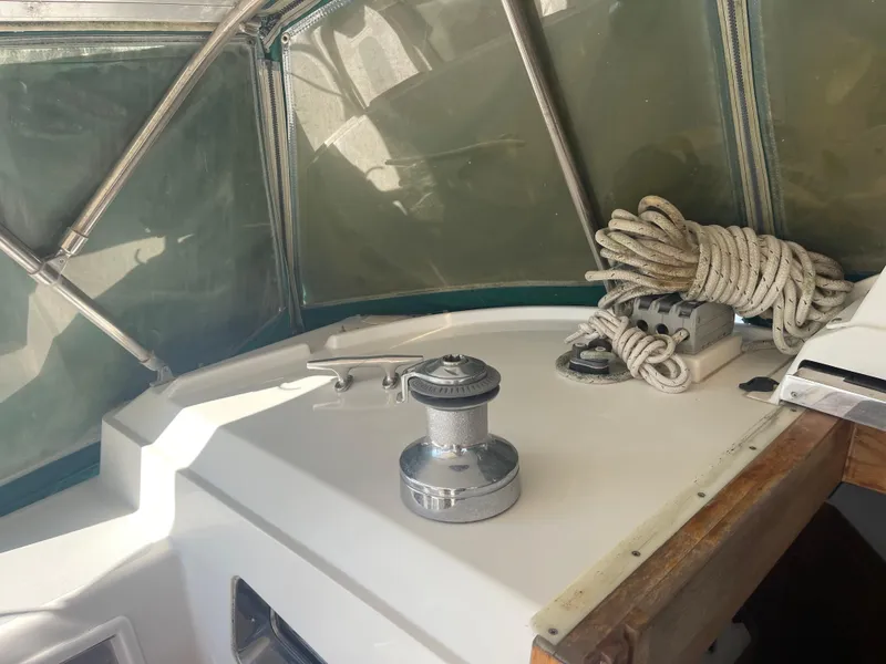 Slide: The Image of Cockpit of 1995 Passport 47 AC Plan B sailboat with winch and coiled ropes. - 16