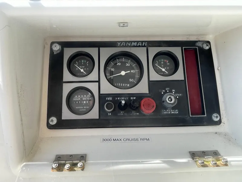 Slide: The Image of Control panel of a 1995 Passport 47 AC Plan B boat with Yanmar engine gauges. - 28