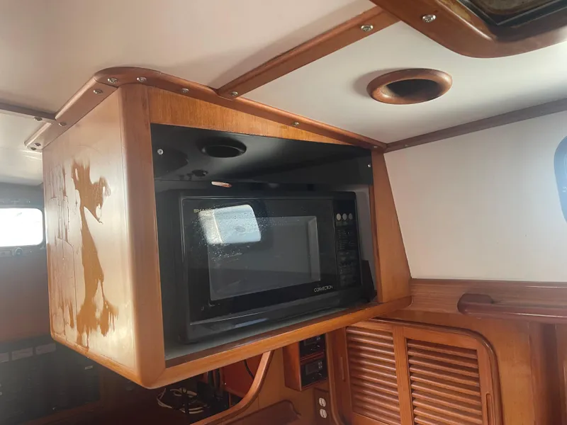 Slide: The Image of Built-in microwave in the galley of a 1995 Passport 47 AC Plan B sailboat. - 31