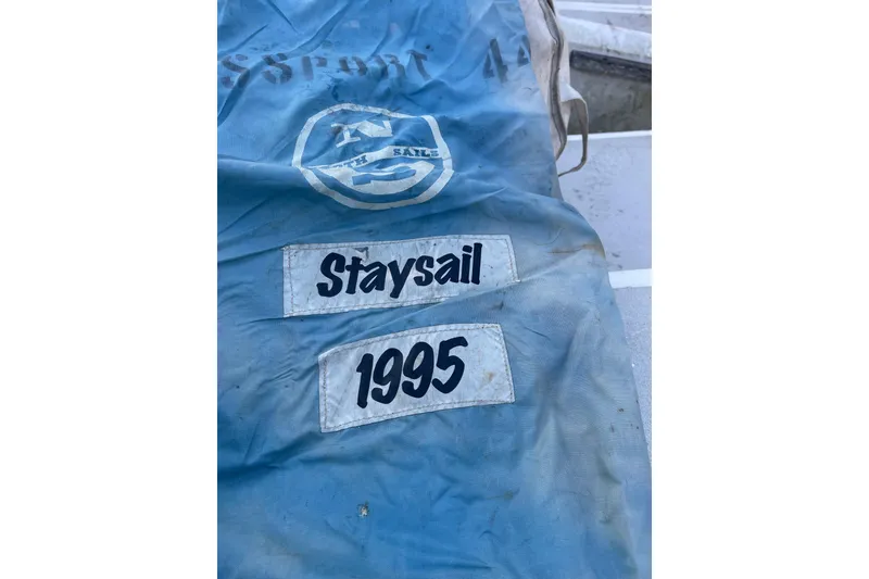 Slide: The Image of Blue staysail bag labeled "Staysail 1995" from Passport 47 AC Plan B yacht. - 45