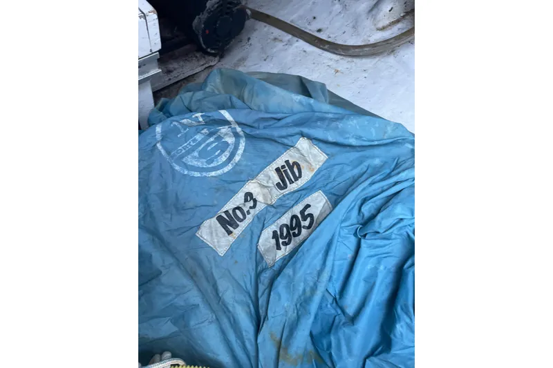 Slide: The Image of Blue sail labeled "No. 3 Jib 1995" on a Passport 47 AC Plan B. - 47