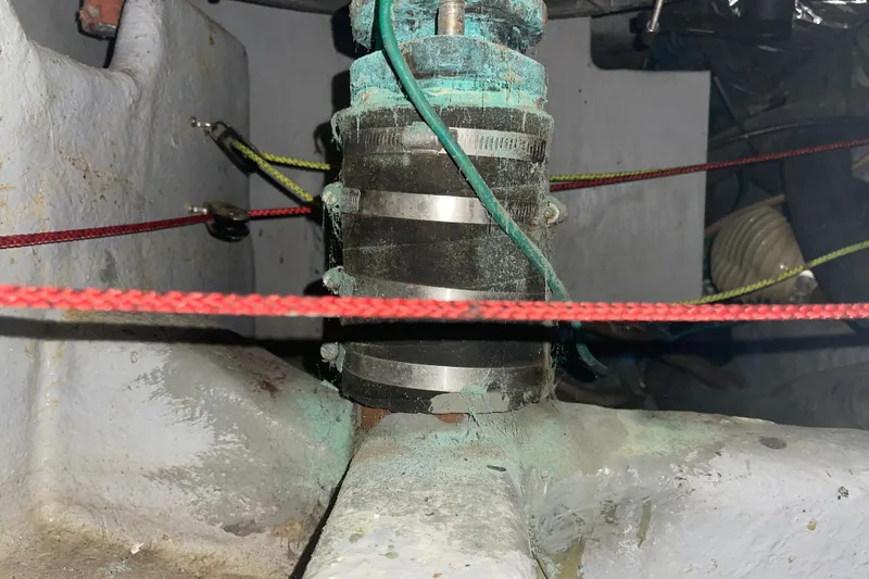 Slide: The Image of Boat engine compartment with ropes and metal fittings, Passport 47 AC Plan B, 1995 model. - 48