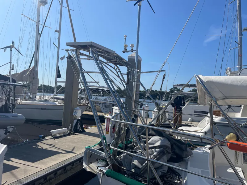 Slide: The Image of Alt text: 1995 Passport 47 AC Plan B sailboat docked at marina on a sunny day. - 5