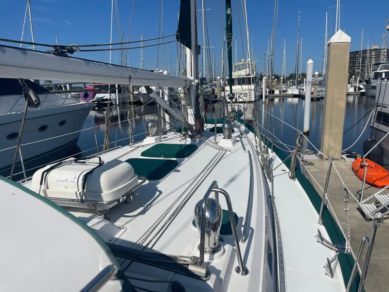 Slide: The Image of Alt text: 1995 Passport 47 AC Plan B sailboat docked at marina. - 6